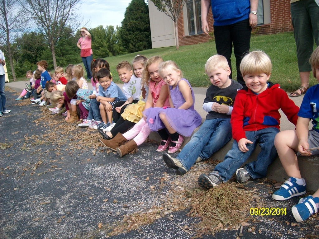 Stepping Stones kids on the curb for a lesson from the local firefighters