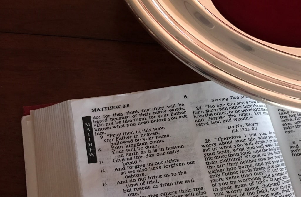 Bible open to Matthew 6:8