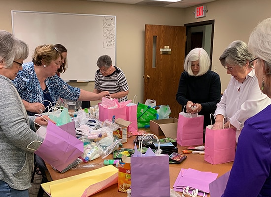 Packing gifts into gift bags