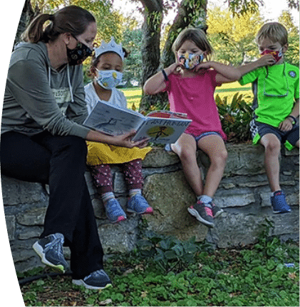 Reading to the kids outside