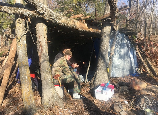 Hunkering down from the sun under a tree fort