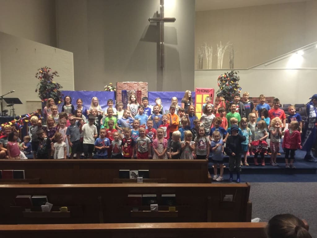 Children singing in the main auditorium